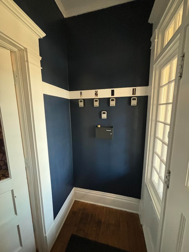 room details with hardwood / wood-style floors and crown molding