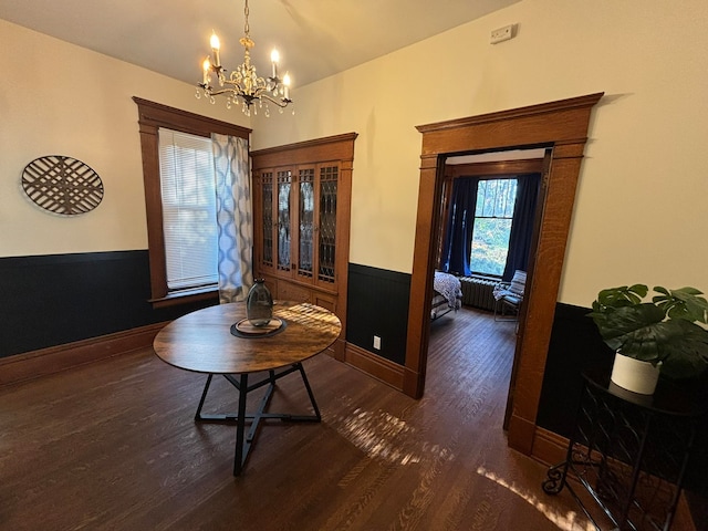 hall featuring dark hardwood / wood-style flooring and a notable chandelier