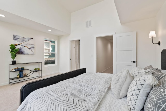 bedroom featuring light carpet