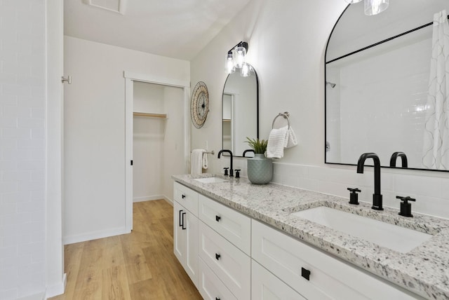 bathroom featuring vanity and hardwood / wood-style floors