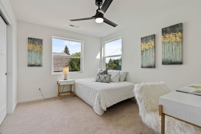 carpeted bedroom featuring ceiling fan