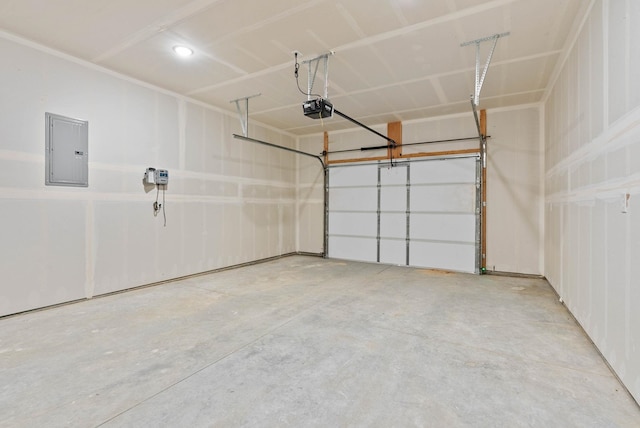 garage featuring electric panel and a garage door opener