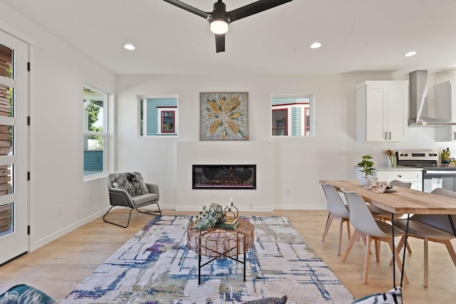 interior space featuring light hardwood / wood-style floors and ceiling fan