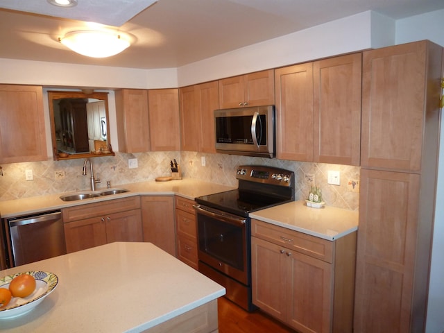 kitchen featuring dark hardwood / wood-style flooring, stainless steel appliances, tasteful backsplash, and sink