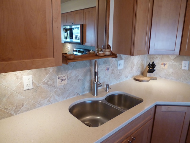 kitchen featuring decorative backsplash and sink