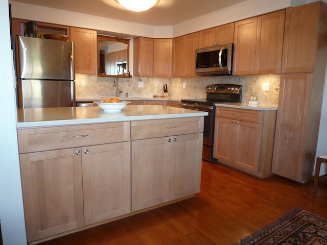 kitchen with decorative backsplash, dark hardwood / wood-style flooring, and stainless steel appliances