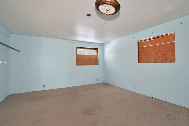 unfurnished room with carpet flooring