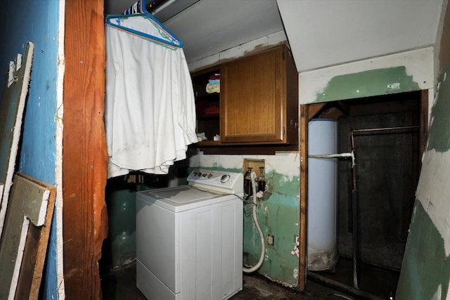 washroom featuring water heater, washer / dryer, and cabinets