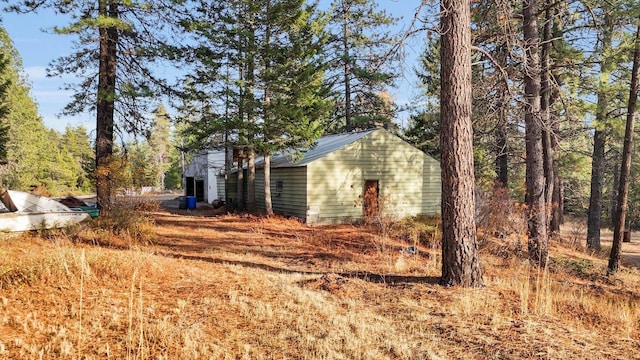 view of side of property featuring an outdoor structure