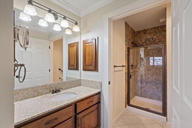 bathroom with vanity, tile patterned flooring, ornamental molding, and a shower with shower door