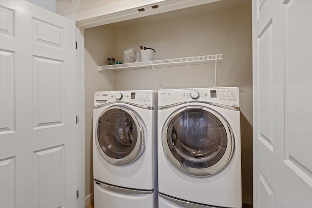 laundry area with separate washer and dryer