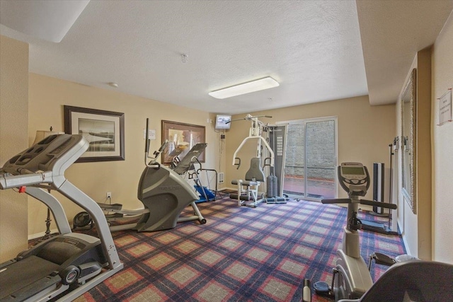 workout area with a textured ceiling