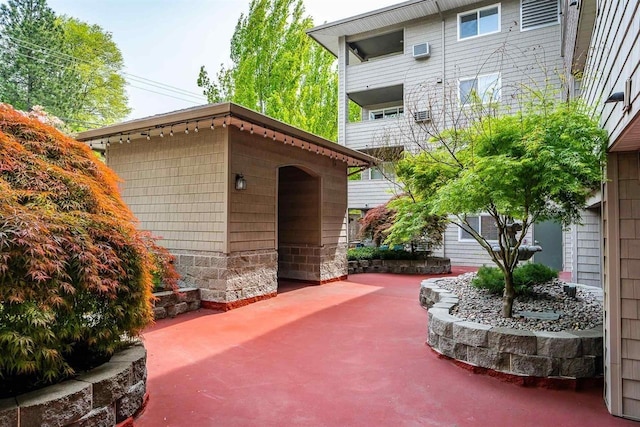 view of patio featuring a balcony