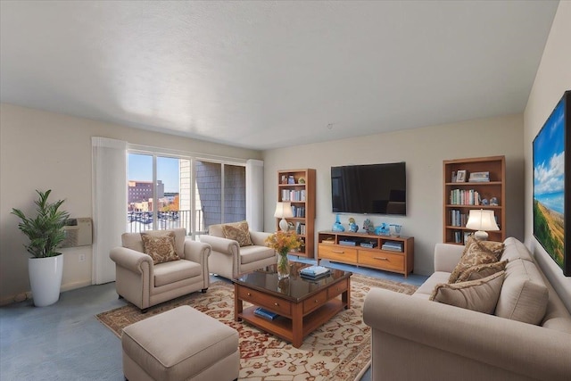 living room with a wall mounted air conditioner and carpet flooring