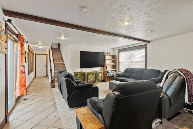 tiled living room with a textured ceiling and beam ceiling