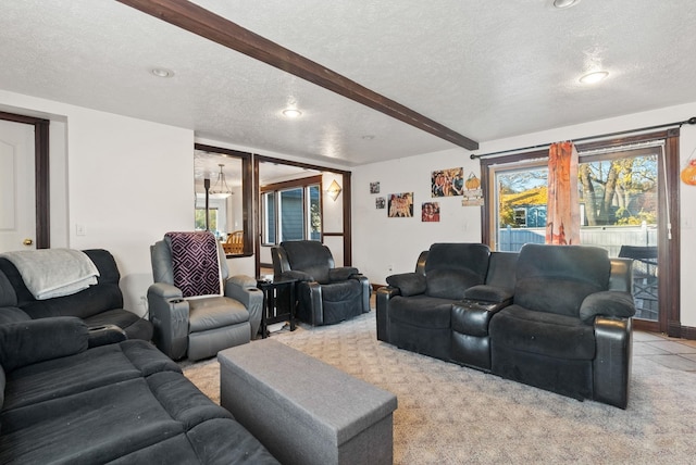 living room featuring light colored carpet, a textured ceiling, and beam ceiling