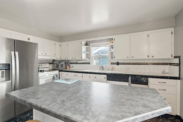 kitchen with white cabinets, white appliances, and decorative backsplash