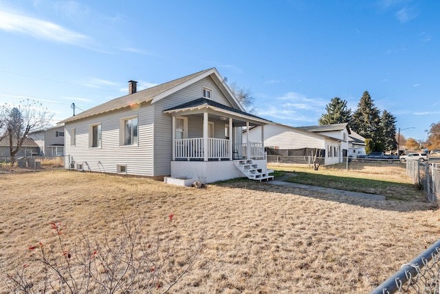 view of front facade with a porch and a front lawn