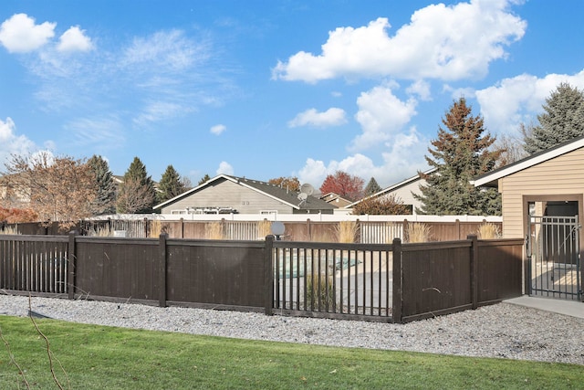 view of pool featuring a lawn