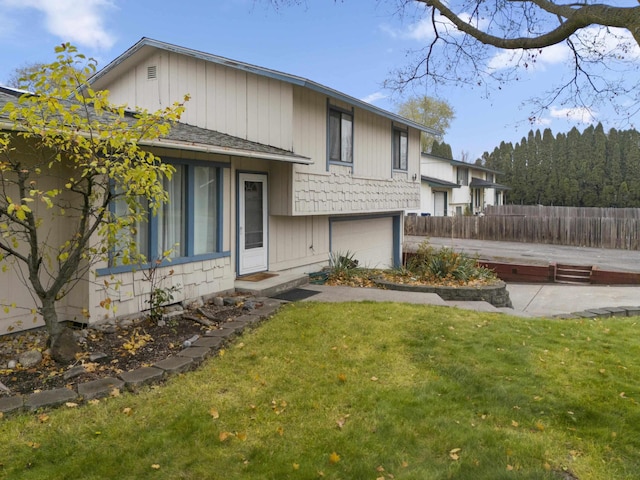 exterior space with a garage and a front yard