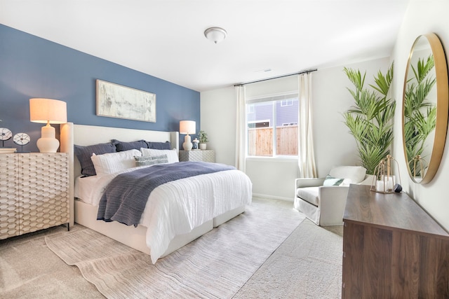 bedroom with light colored carpet