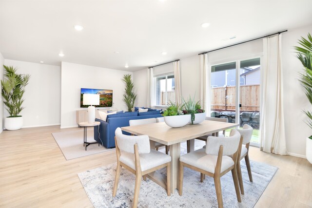 dining space featuring light hardwood / wood-style floors