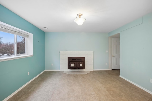 unfurnished living room featuring carpet flooring