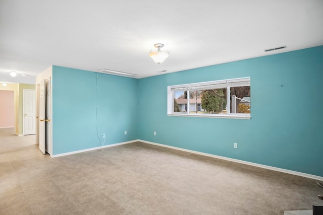 empty room with light colored carpet