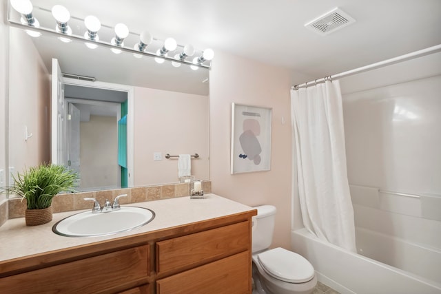 full bathroom featuring tile patterned flooring, vanity, toilet, and shower / bathtub combination with curtain