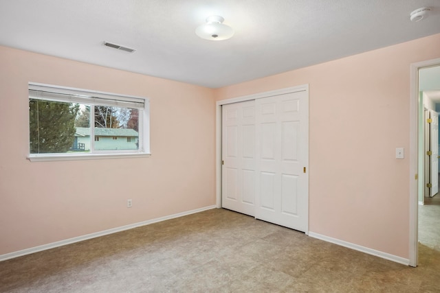 unfurnished bedroom with a closet