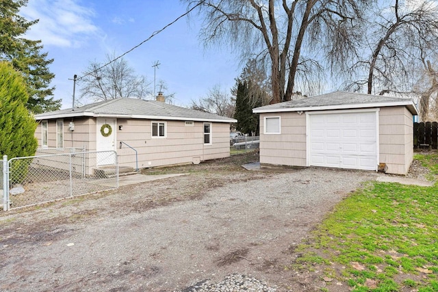 exterior space featuring an outbuilding and a garage