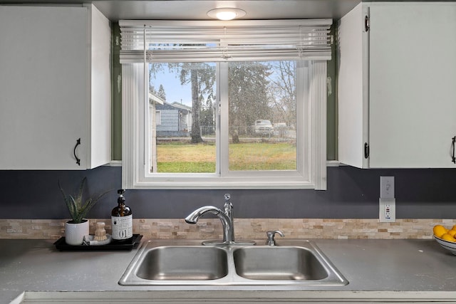 kitchen with white cabinets and sink