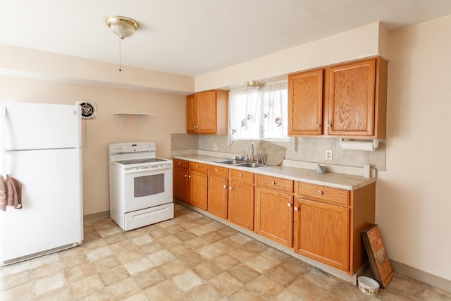 kitchen with backsplash, white appliances, and sink