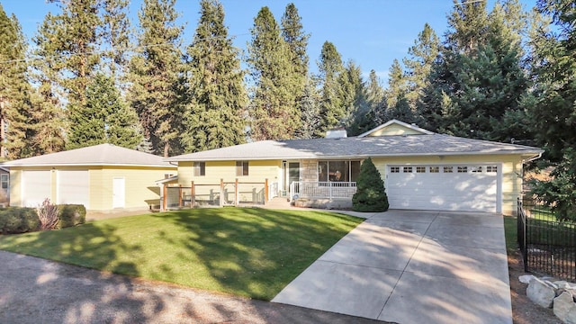 ranch-style home with a front lawn and a garage