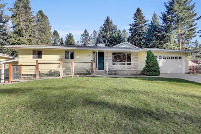 ranch-style home with covered porch, a garage, and a front lawn