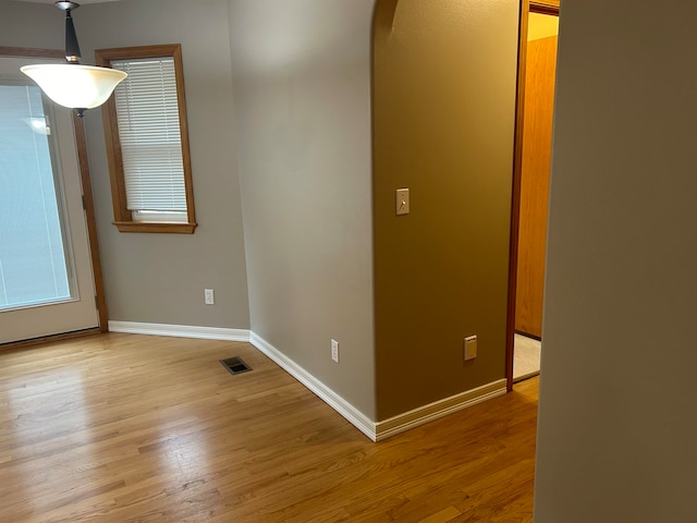 spare room with light hardwood / wood-style floors