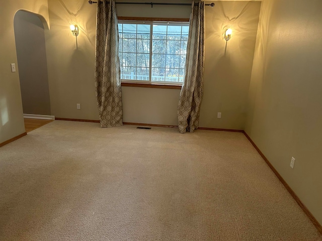 unfurnished room with carpet floors