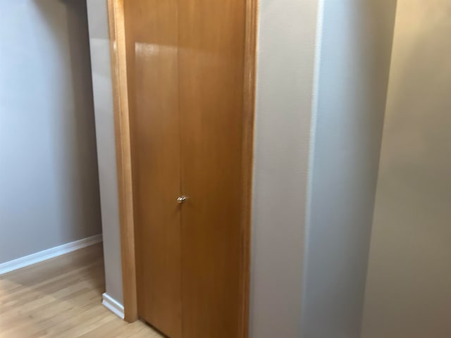 hallway with light wood-type flooring