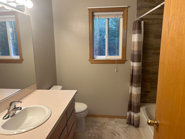 full bathroom featuring toilet, shower / tub combo with curtain, and vanity