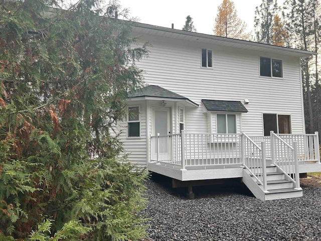 back of house featuring a deck