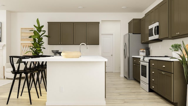 kitchen with light hardwood / wood-style floors, dark brown cabinets, range, and tasteful backsplash