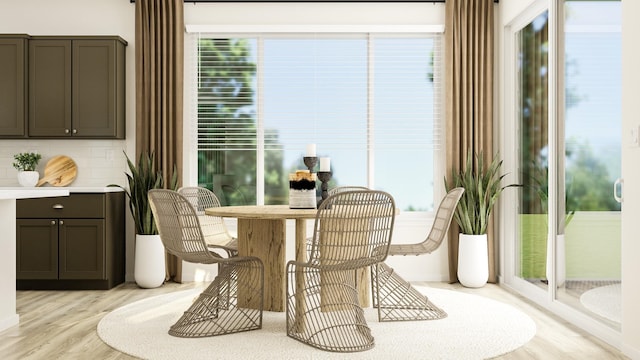 dining space featuring light wood-type flooring