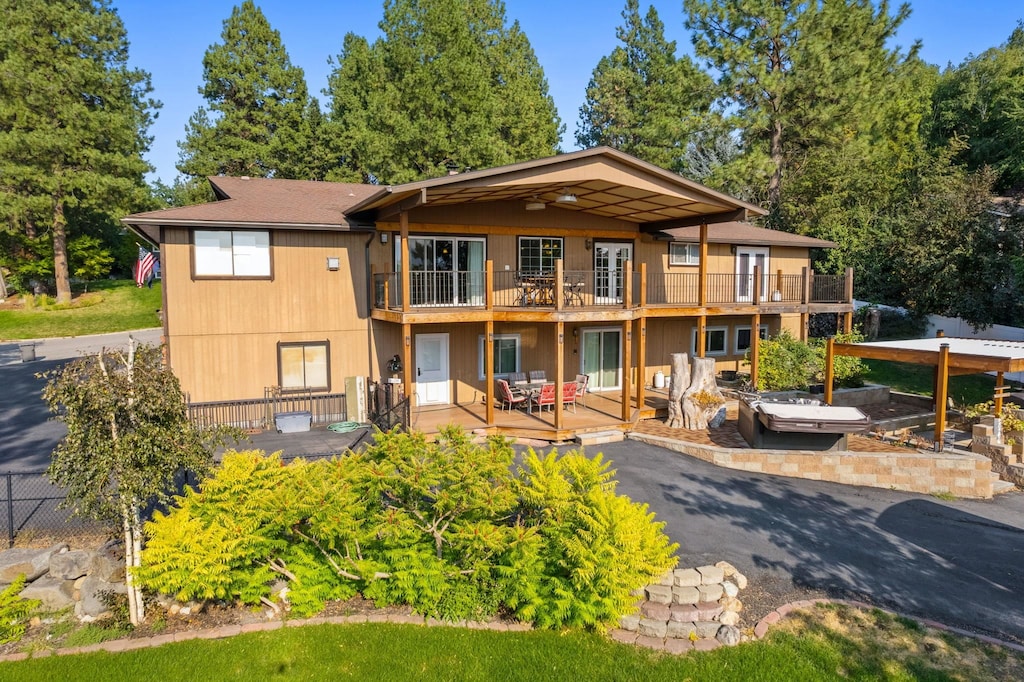 back of property with a patio area and a deck