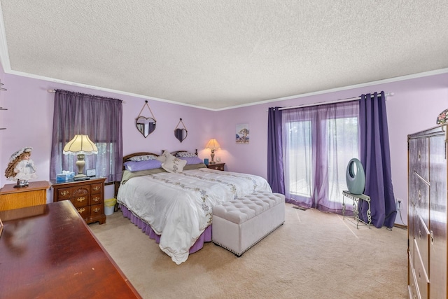 bedroom featuring ornamental molding, a textured ceiling, and light carpet