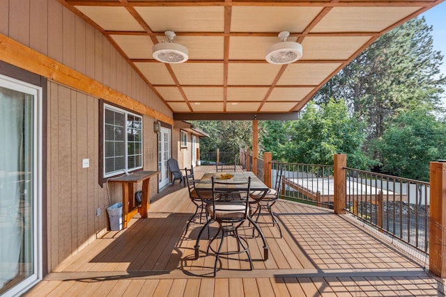 wooden deck featuring ceiling fan