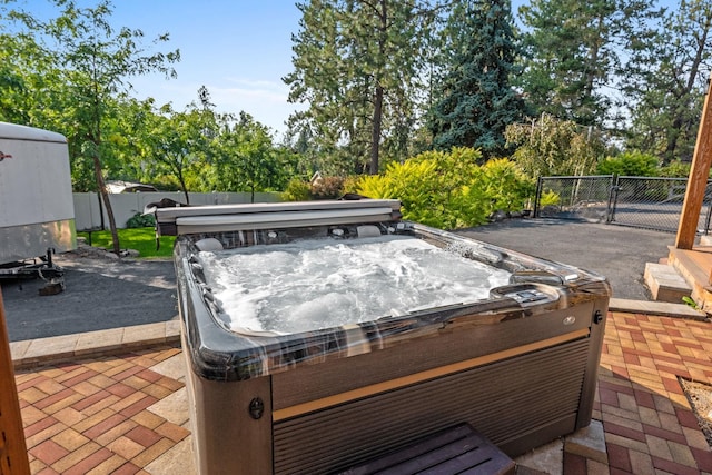 view of patio / terrace with a hot tub