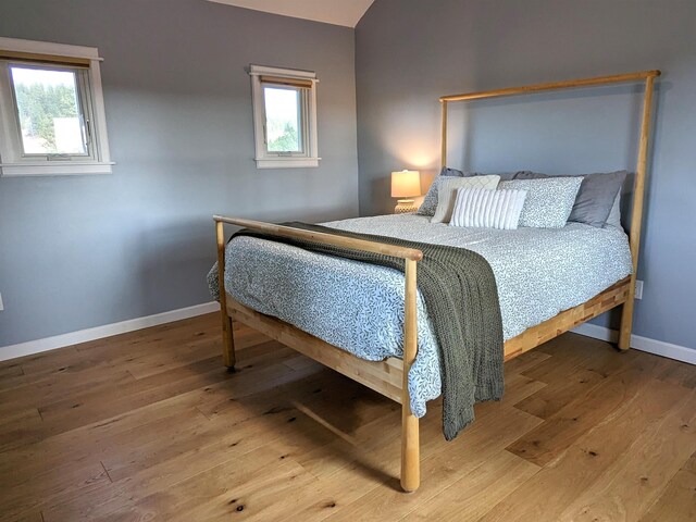 bedroom with wood-type flooring