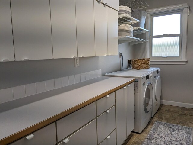 laundry room with cabinets and independent washer and dryer