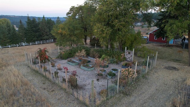 birds eye view of property with a rural view