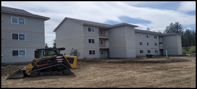 back of property with central AC unit